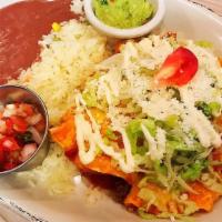 Trio Mexican Enchiladas With Red Sauce Or Salsa Verde · One steak, one chicken and one cheese enchilada. Served with a side of guacamole and pico de...