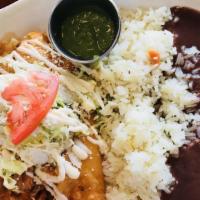 Mole Chicken Enchiladas · Three chicken enchiladas smothered with our mole sauce. Garnished with diced onions, Cotija ...