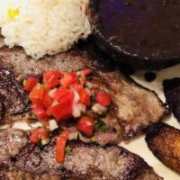 Grilled Salvadoran Steak / Carne Asada · Grilled steak served with pico de gallo.