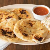 Two Cheese Pupusas · Served with pickled cabbage and red sauce.