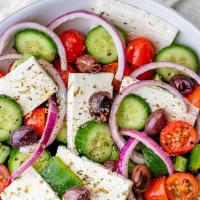 Greek Salad · Fresh tomato, feta cheese, cucumbers, onions, oregano, peppers and virgin olive oil.