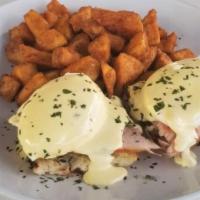 Eggs Benedict · Grilled baguette, 2 soft poached eggs. country ham & hollandaise. Served with home fries.