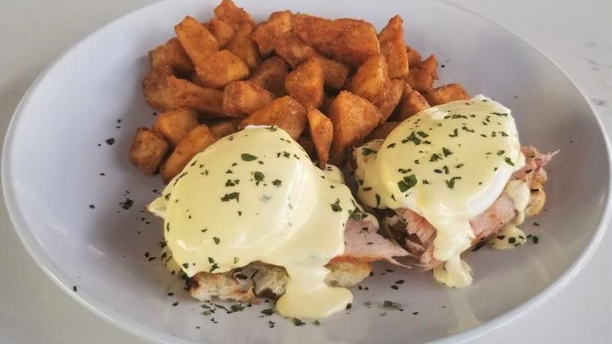 Eggs Benedict · Grilled baguette, 2 soft poached eggs. country ham & hollandaise. Served with home fries.