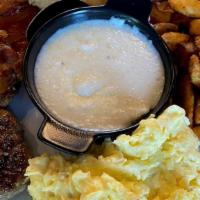 Hurricane Plate · Bacon AND sausage, 3 eggs, grits, toasted baguette & home fries.