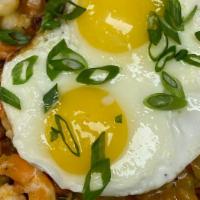 Wandering Cajun · Home fries smothered with New Orleans style etouffée, Mayport shrimp, 2 sunny-side up eggs &...