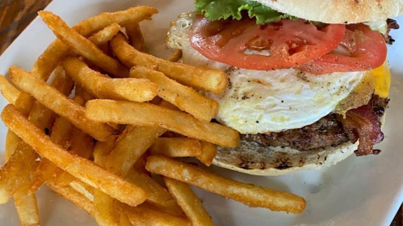 The Brunch Burger · certified angus beef, lettuce, tomato, cheddar, bacon, fig aioli & an egg on grilled ciabatta.