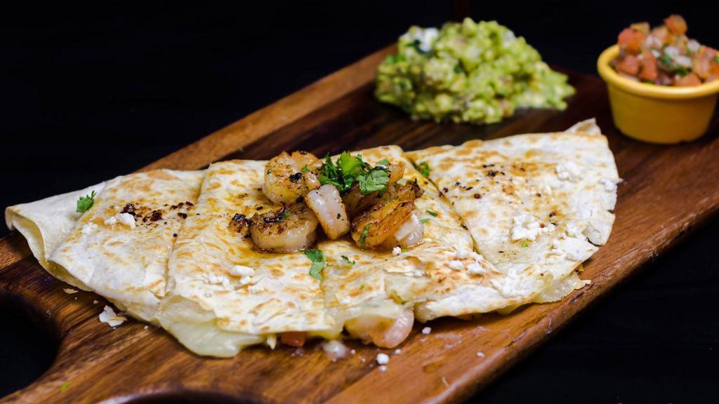 Shrimp Quesadilla · Filled with our famous chihuahua cheese and sauteed shrimp.