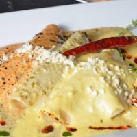 Bicentenario Enchiladas · Filled with gourmet picadillo and topped with three of chef Omar's famous sauces and fresco ...