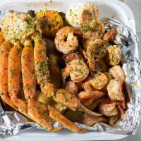 Full Combo Plate · One snow crab cluster, jumbo shrimp, sausage, eggs, potatoes, and corn.