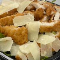 Crispy Chicken Tenders Salad · Romaine lettuce, 'tomato, shredded carrot, red onion, raisins, croutons, shaved parmesan che...