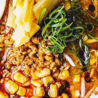 Spicy Pork Ramen · Miso broth, spicy pork, bamboo shoots, bean sprouts, green onion, corn, soy egg