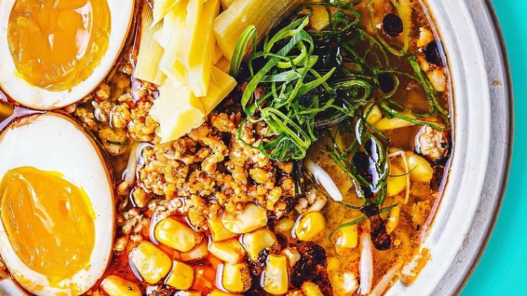 Spicy Pork Ramen · Miso broth, spicy pork, bamboo shoots, bean sprouts, green onion, corn, soy egg