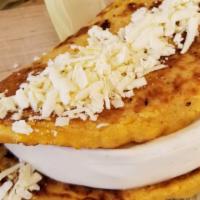 Cachapas (Sweet Corn Pancakes) · w/ Queso de mano and topped with queso llanero