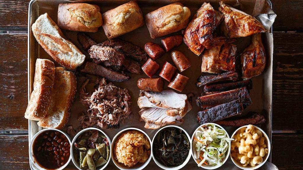 The Motherload · Enough for six! Brisket, pulled pork, turkey, a half slab of ribs, a half chicken, two sausages, six individual sides, cornbread, and Texas toast