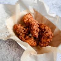 Chicken Tenders · Marinated in buttermilk, spiced with our signature dry rub, hand-battered, and fried to order