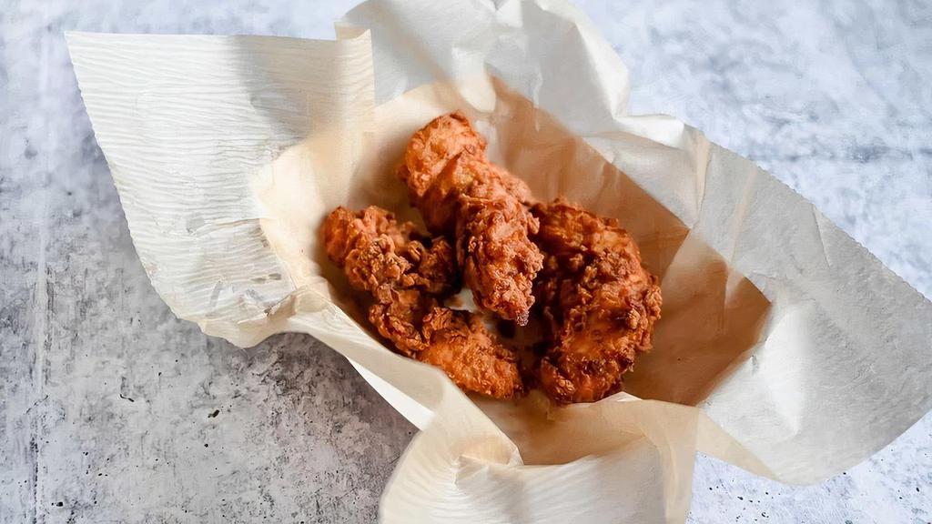 Chicken Tenders · Marinated in buttermilk, spiced with our signature dry rub, hand-battered, and fried to order