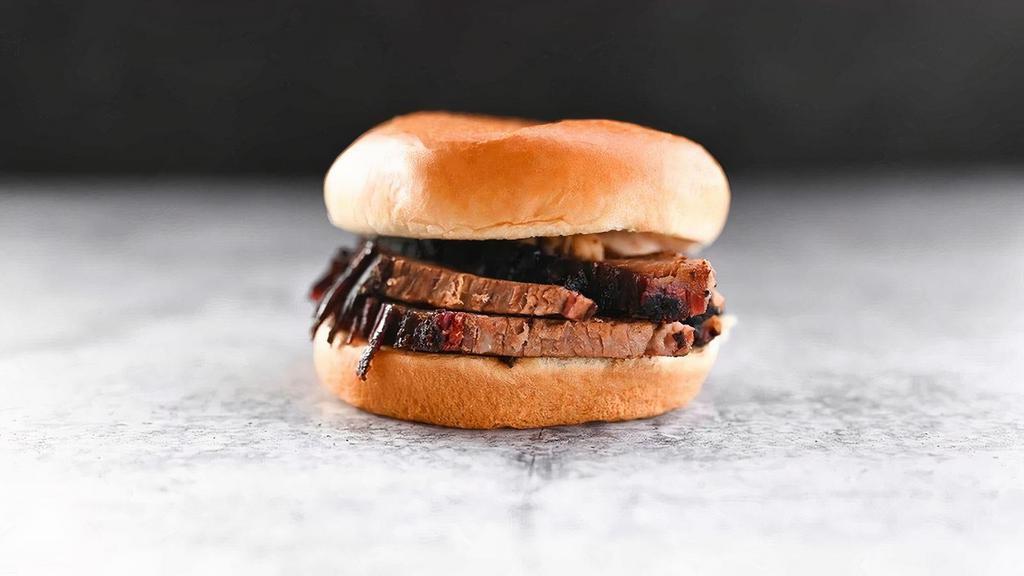 Kids Beef Brisket · Smoked for up to 18 hours and always carved to order, served with one kid's-sized side and drink