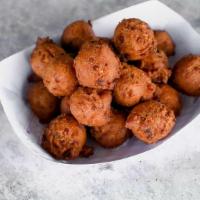 Basket Of Hush Puppies · Crispy on the outside, soft on the inside, and hand-dipped fresh, right when you get here (p...