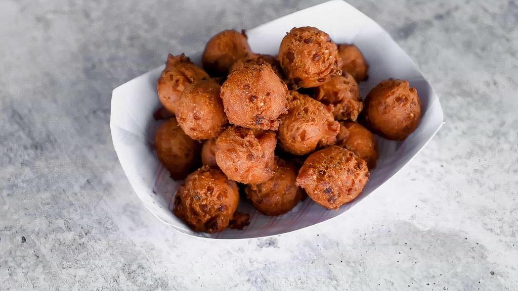 Basket Of Hush Puppies · Crispy on the outside, soft on the inside, and hand-dipped fresh, right when you get here (please allow three minutes)