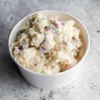 Potato Salad  · Redskin potatoes, eggs, onions, and celery in a mayo and mustard dressing