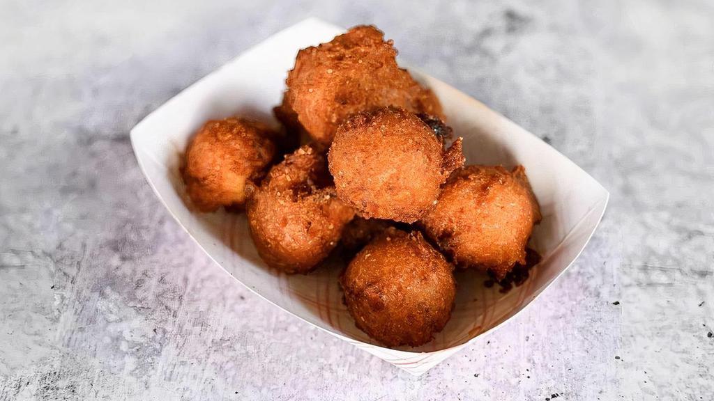Hush Puppies · Crispy on the outside, soft on the inside, and hand-dipped fresh, right when you get here (please allow three minutes)