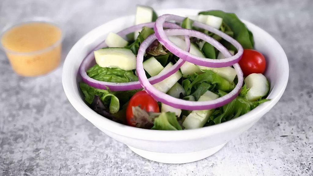 Side Salad · Spring mix, romaine, grape tomatoes, red onions, and hand-diced cucumbers