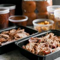 Feeds 14-16 · Your choice of two meats (2.5 pounds each) and two sides (2.5 quarts each), buns, and sauce ...