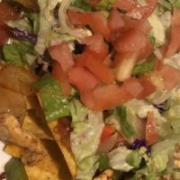 Nachos Fajitas · Char grilled chicken Or flank steak Or combo, sauteed green peppers and onions, lettuce, tom...