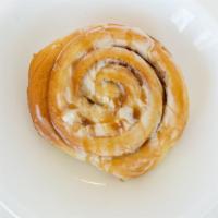 Caramel Cinnamon  Rolls · Homemade Cinnamon Roll topped with cream cheese icing topped with from scratch caramel sauce