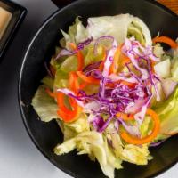 House Salad · Lettuce, red cabbage, carrots, served with our home made ginger dressing.