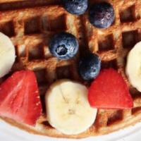 Protein Waffle · Topped with banana, seasonal fruits, honey or syrup.