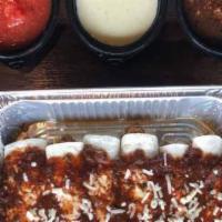 Burrito Family Meal · Enjoy 6 Mini burritos with your choice of Ground beef or pulled chicken. Mexican Rice, Refri...