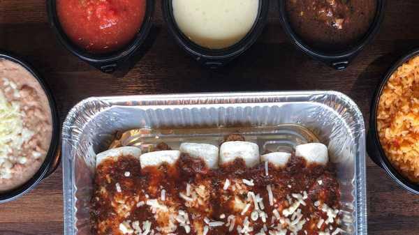 Burrito Family Meal · Enjoy 6 Mini burritos with your choice of Ground beef or pulled chicken. Mexican Rice, Refried Beans, Chips, Salsa and our Famous Cheese dip.