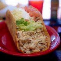 Crazy Taco · Jumbo flour tortilla shell stuffed with shredded chicken or ground beef, fresh lettuce, toma...