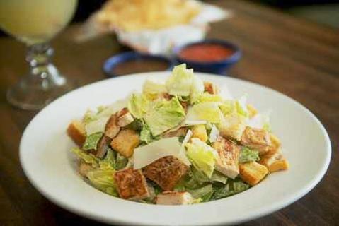 Caesar Salad · Fresh Romain lettuce, Mixed with Caesar Salad Dressing Topped with grilled chicken , Croutons and Parmesan Cheese.