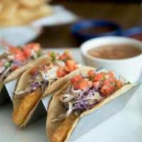 Ensenada Fish Tacos · Lightly battered and fried cod fish or grilled tilapia with your choice of corn or flour tor...