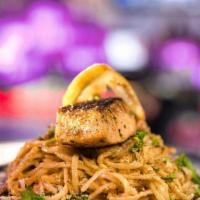 Cajun Alfredo · Linguine pasta tossed in a homemade cajun cream sauce with cheese and roasted garlic and her...