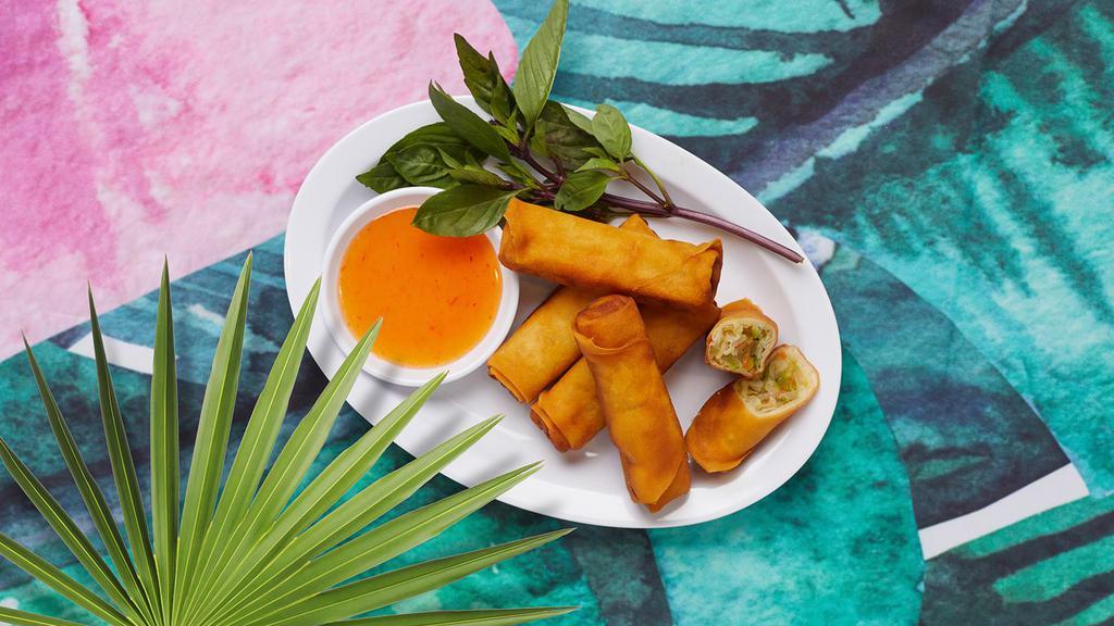 Vegan Vegetable Spring Roll · Cabbage, carrots, and glass noodles in a crispy pastry roll. Served with dipping sauce.