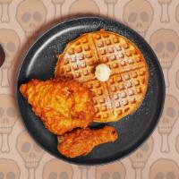 Fried Chicken And Waffles · Crispy fried chicken thighs with a fluffy Belgian waffle, and served with butter, maple syru...