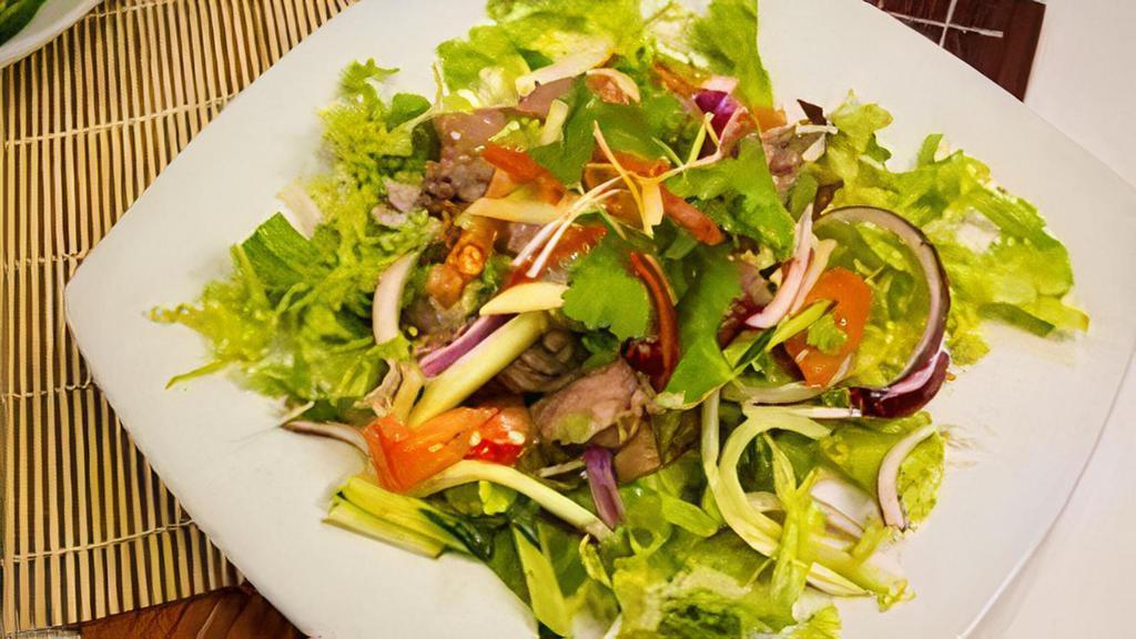 Ss3 - Yum Nuer / Beef Salad · Grilled beef strips mixed with fresh Thai chili, cucumber, tomatoes,  onion,cilantro and drizzled Served with green leaf lettuce.