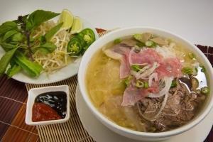 P1 - Pho Dac Biet · With various slim cuts of beef bathing in a clear mahogany beef broth, this pho bowl is pack...