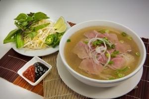 P2 - Pho Tai · A layer of thin, rare eye round steak is cooked by the beef broth right in your bowl, bringi...