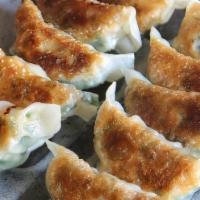 Gyoza · Steamed pork dumplings with a sweet shoyu dipping sauce.