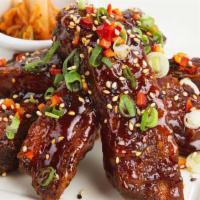 Korean Ribs · Baby Back Ribs with Our Sweet and Spicy Korean BBQ Sauce
