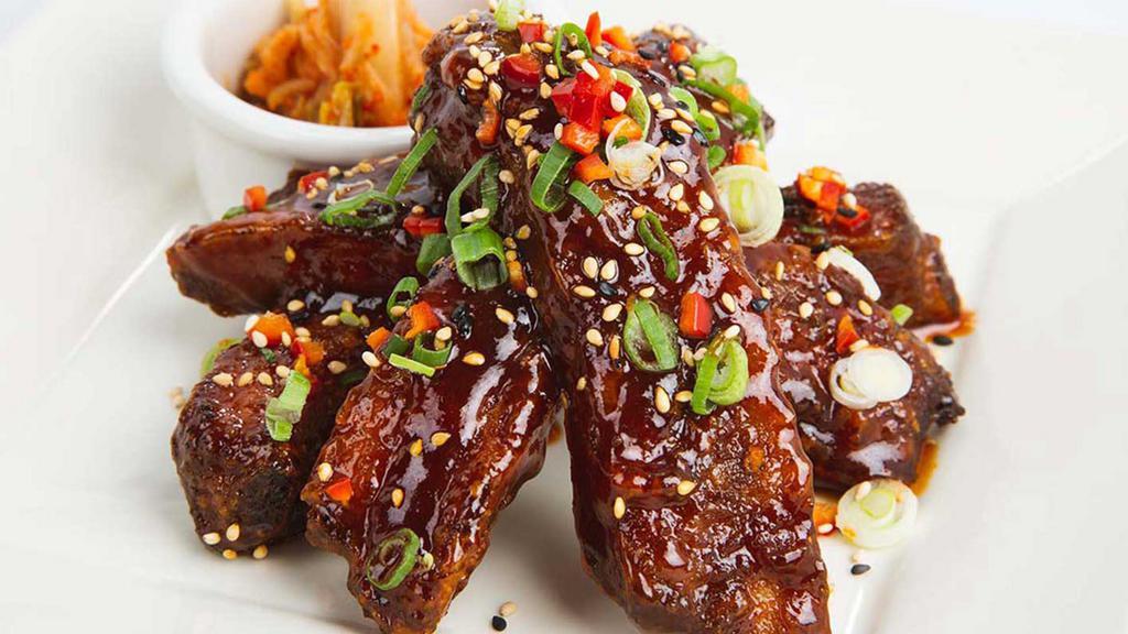 Korean Ribs · Baby Back Ribs with Our Sweet and Spicy Korean BBQ Sauce