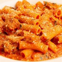 Spicy Vodka Pasta · Rigatoni, Italian Sausage, Pancetta and Parmesan Tossed with Spicy Vodka Sauce