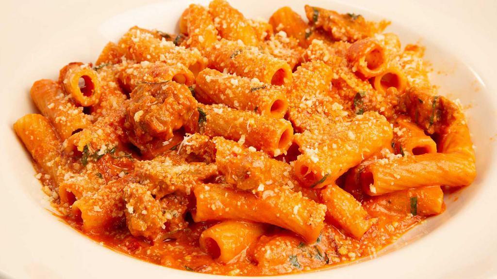 Spicy Vodka Pasta · Rigatoni, Italian Sausage, Pancetta and Parmesan Tossed with Spicy Vodka Sauce