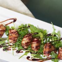 Bacon Wrapped Dates · Stuffed with two cheeses.