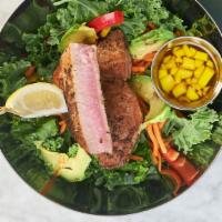 Ahi Tuna Kale Salad · Seared ahi-tuna steak, kale, carrots, corn, red peppers, avocado and mango sesame dressing.