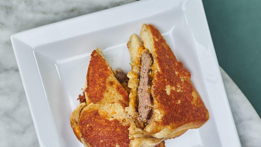 Burger Melt With Spicy Mayo · Our signature beef blend with melted Cheddar, caramelized onions, spicy mayo, on a Parmesan crusted sourdough bread.